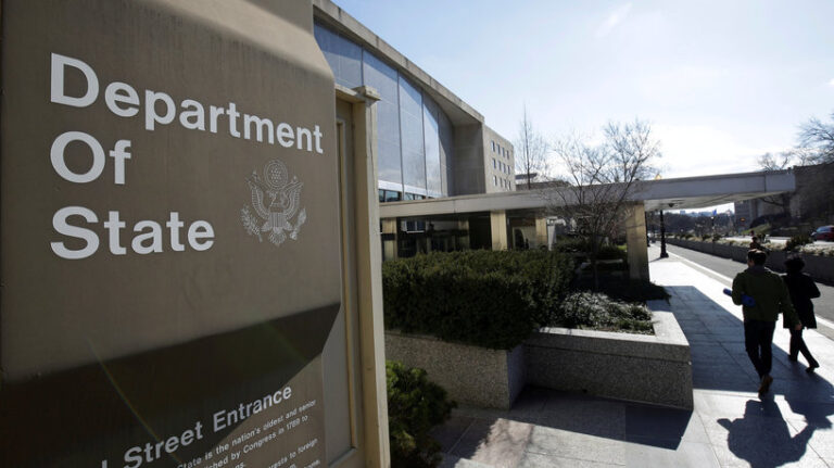 File Photo: People Enter The State Department Building In Washington